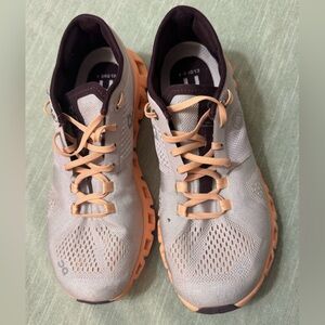 On Running Shoes in Orange and burgundy